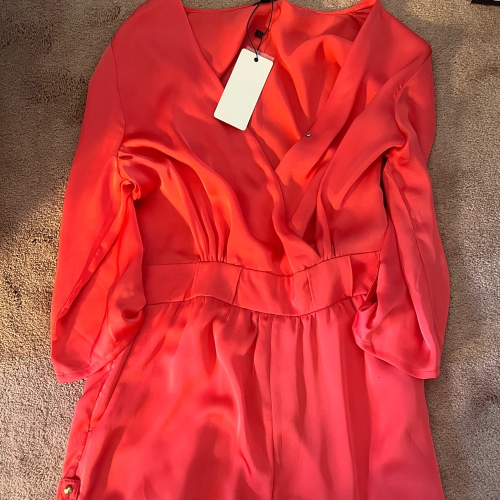 Brand new. Size S, 3/4 sleeve coral romper.